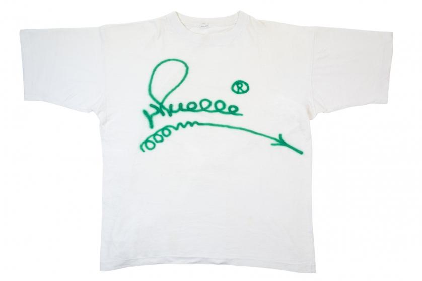 Dock. A green tag on a white T-shirt