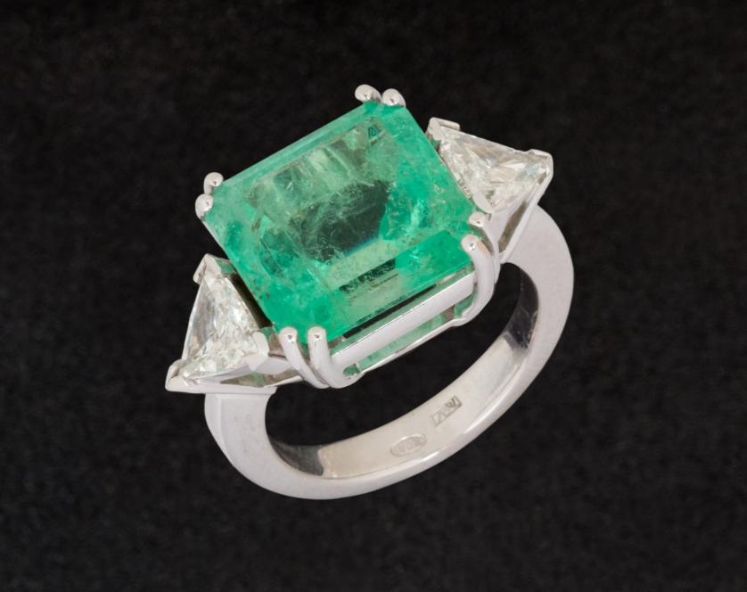 8.42 cents. emerald and diamond ring
