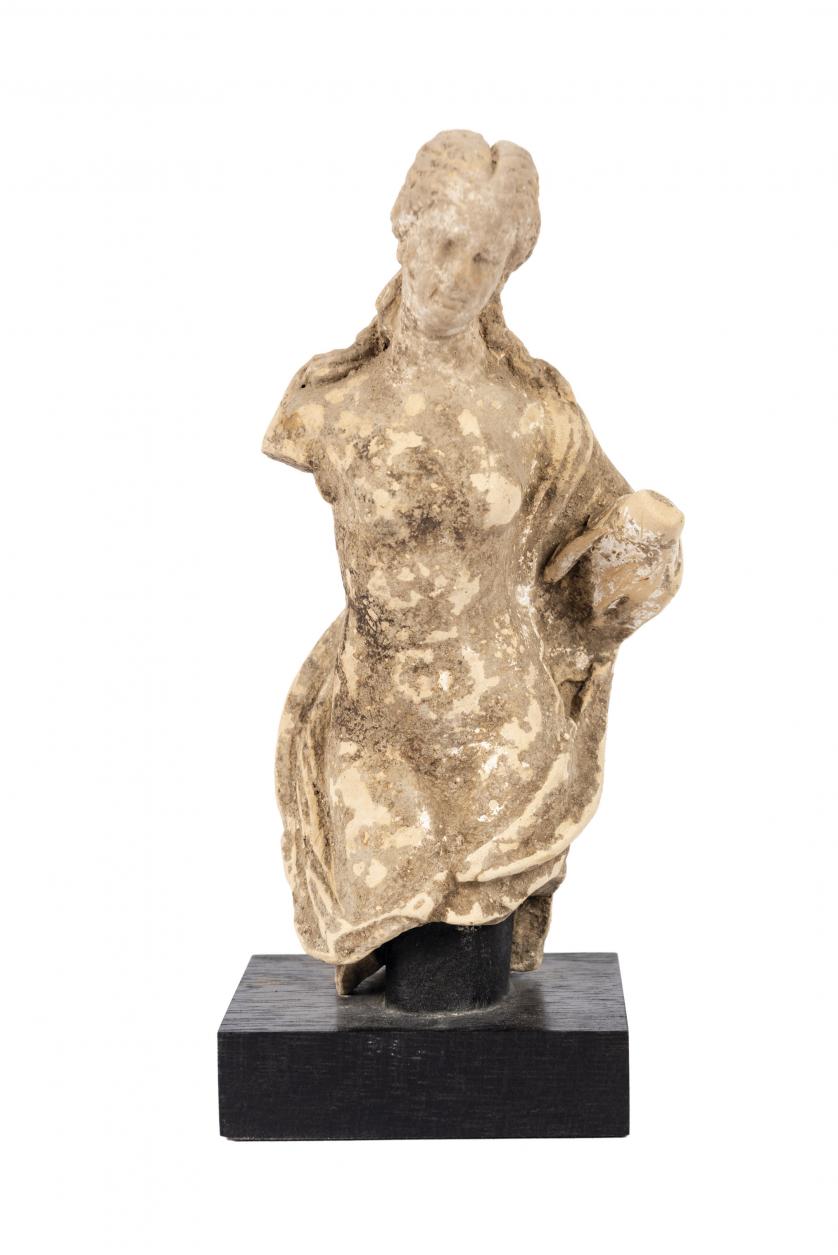 Female clay figure. Ancient Greece