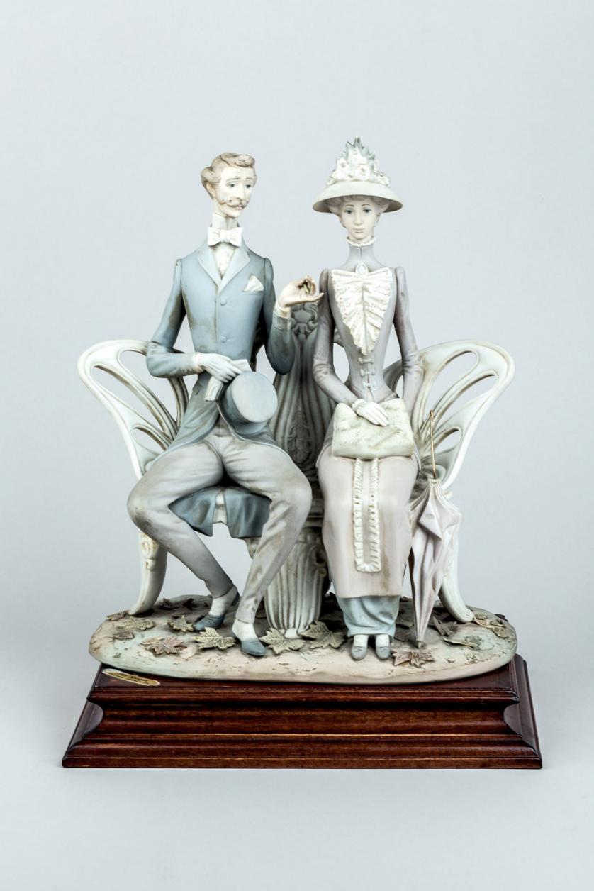 A Spanish Lladro biscuit of a romantic couple