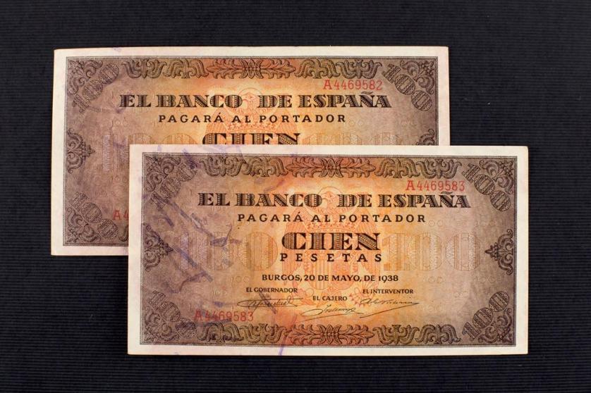 Dos billetes de 100 pesetas.