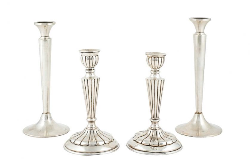 Two pairs of Spanish silver candlesticks
