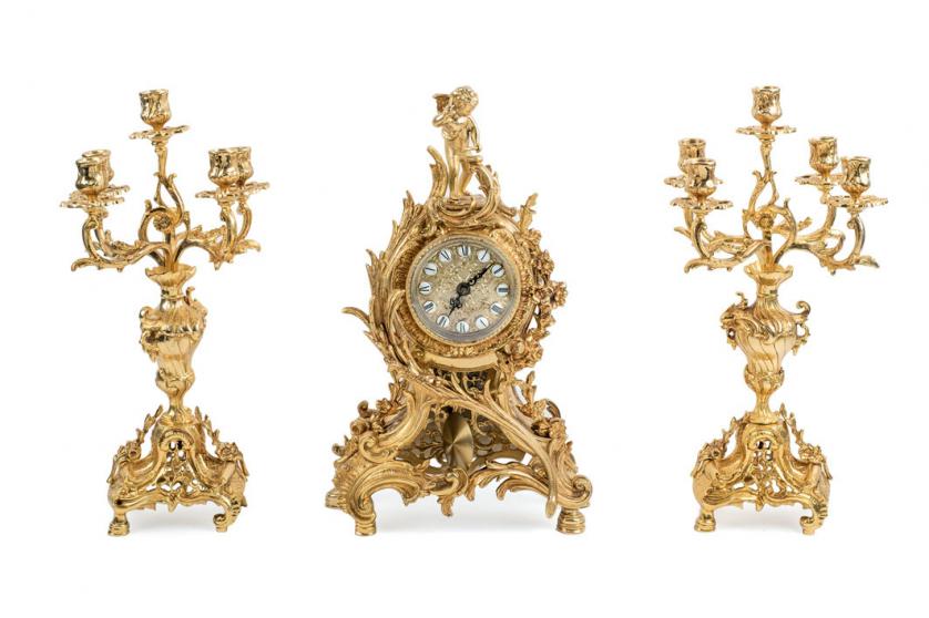 Rococo style clock and candlesticks