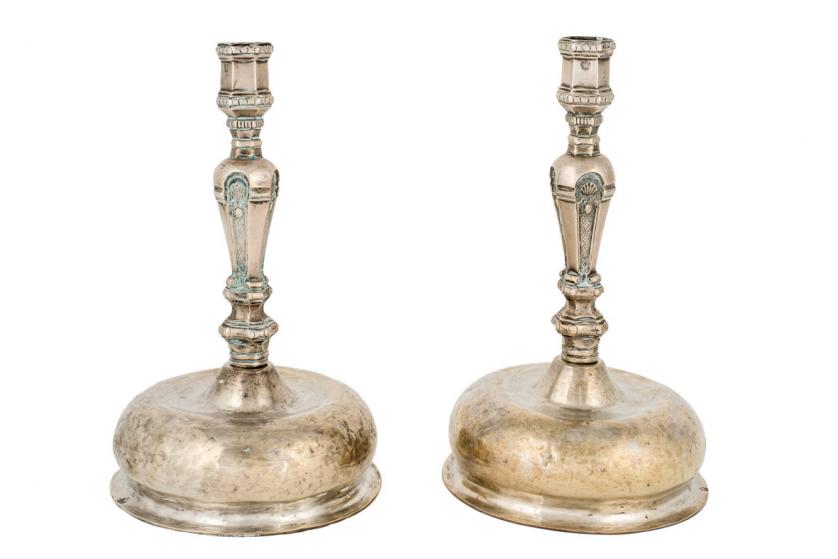 A pair of silver candle sticks. Guatemalan 18th
