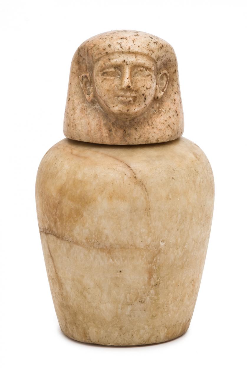 An Egyptian alabaster canopic jar. 1060 - 664 BC